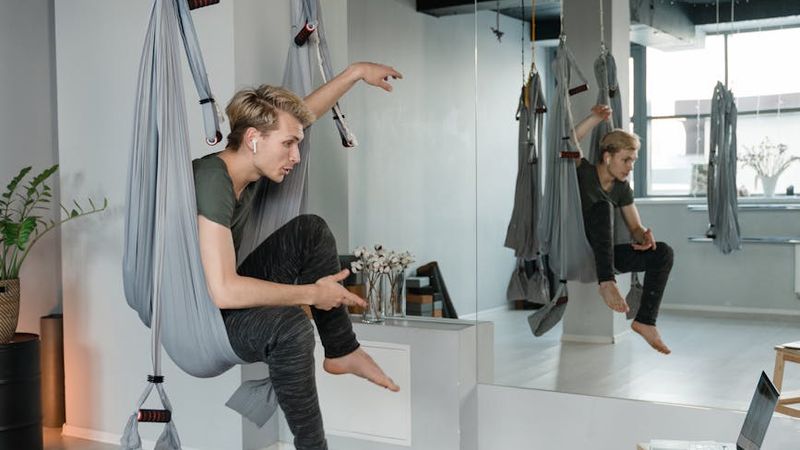 Interior of a modern yoga studio with wooden floors.